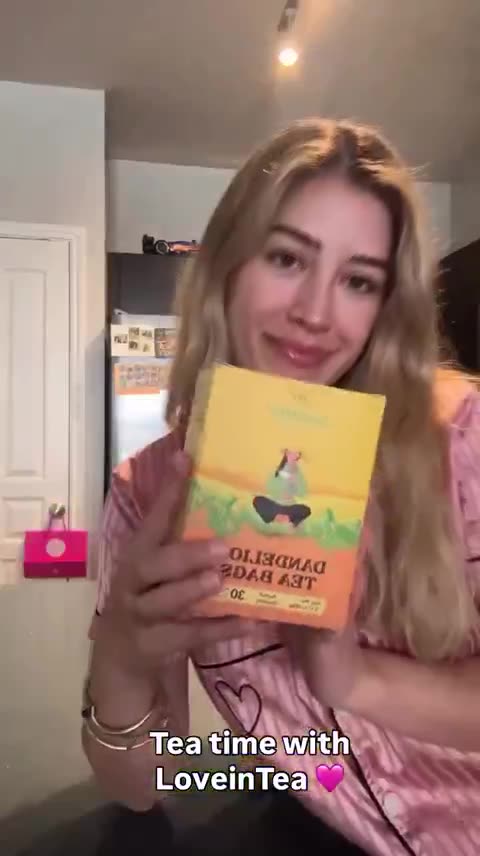 Creator opens Dandelion and reads the herb booklet