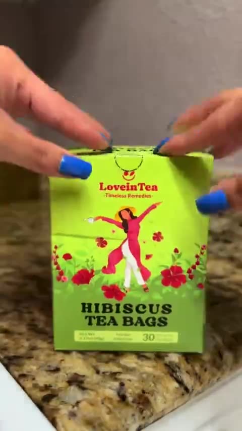 Two mugs of Hibiscus by lamplight