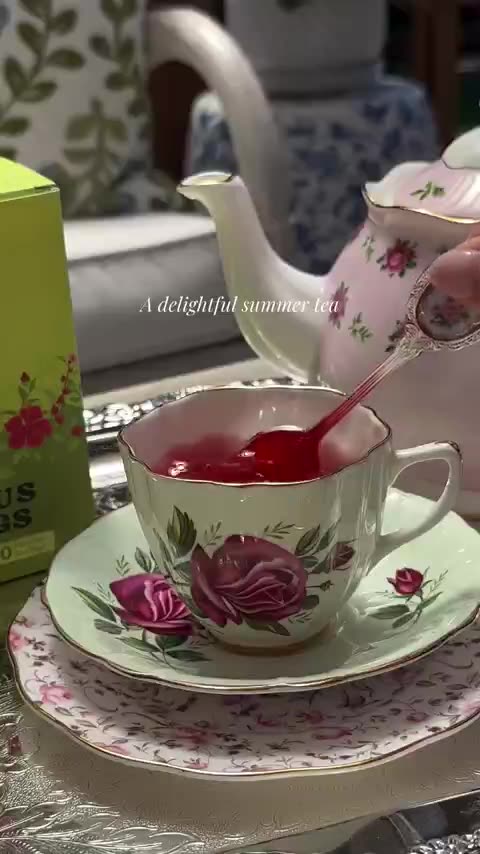 Garden tea party with Hibiscus in a rose teapot