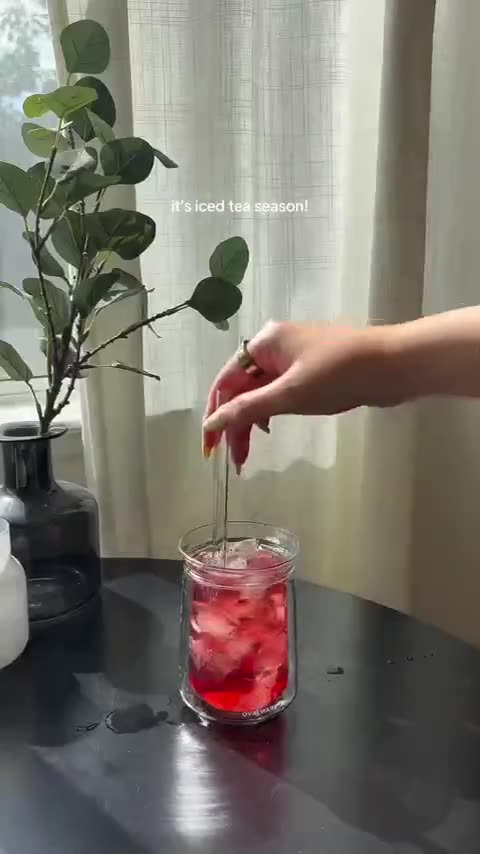 Iced hibiscus tea brewed by a window