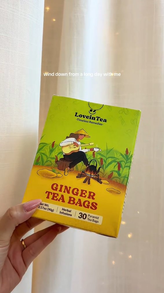 Ginger box held against a sheer curtain