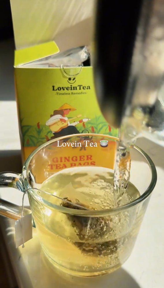 Ginger tea steeping in a clear glass mug