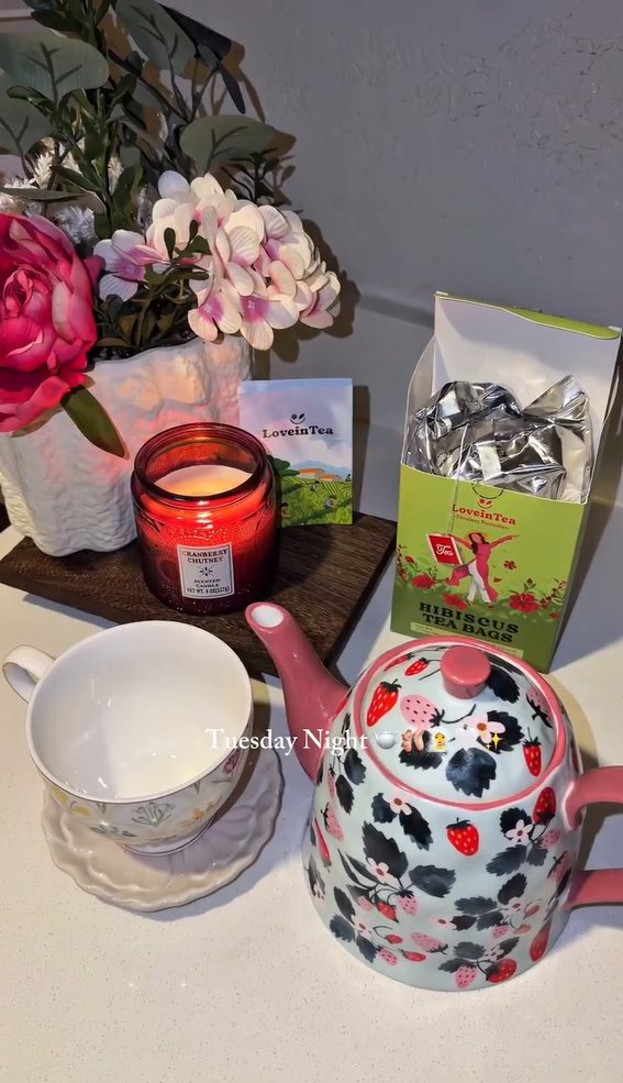 Tuesday night tea setup with a strawberry teapot and Hibiscus box