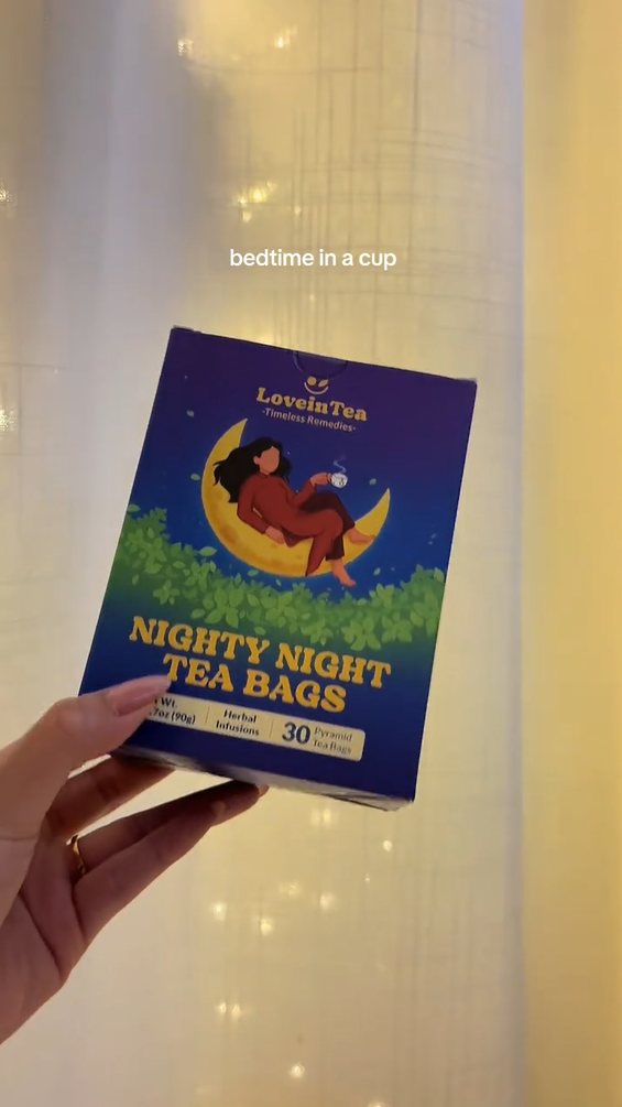 Cozy Moon box held up against fairy lights