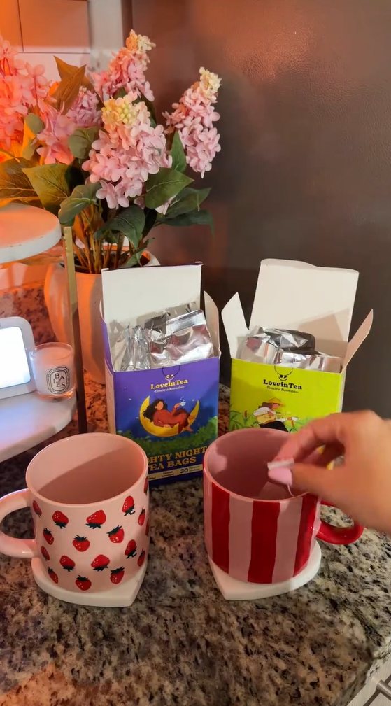 Strawberry mugs beside open Cozy Moon and Ginger boxes